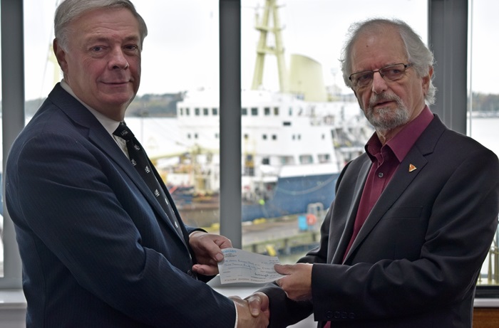 Karl Lumbers of Trinity House with NBT President Peter Willis. In the background is the Trinity House flagship maintenance vessel Patricia.